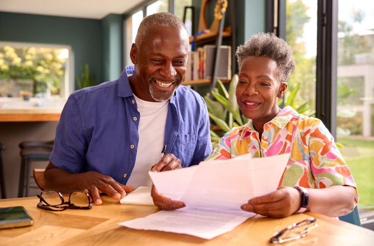 couple happily looking over finances
