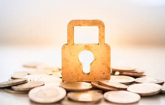 padlock on top of coins